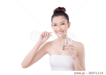 Woman taking medicine over white background 36971124