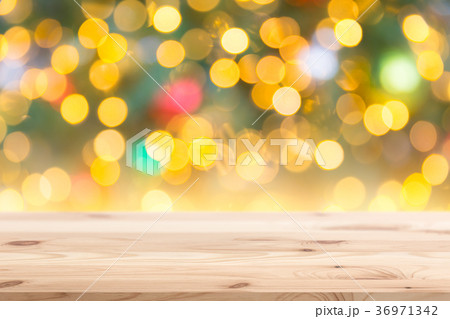 Christmas Blur Bokeh with wooden background Christmas Blur Bokeh with wooden background 36971342