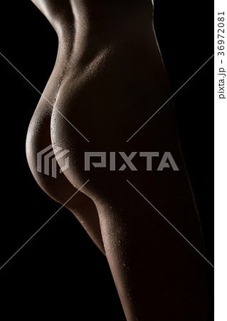 Cropped rearview shot of woman posing nude 36972081