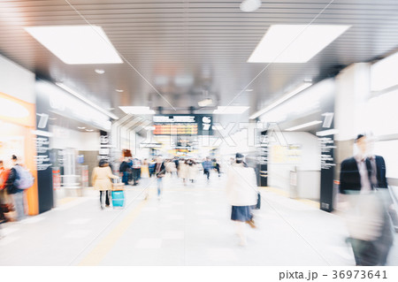 Blurred Business People Rushing in Train Station 36973641
