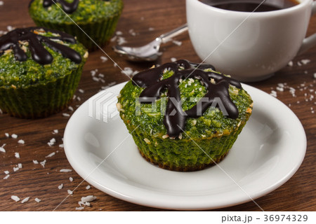 Fresh muffins with spinach, desiccated coconut 36974329