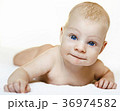 A child on a white background with blue eyes 36974582