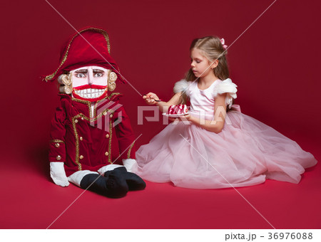 The beauty ballerina standing with nutcracker The beauty ballerina standing with nutcracker 36976088