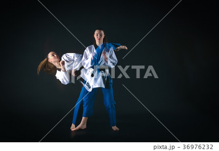 The karate girl with black belt 36976232