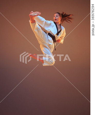 The karate girl with black belt 36976294