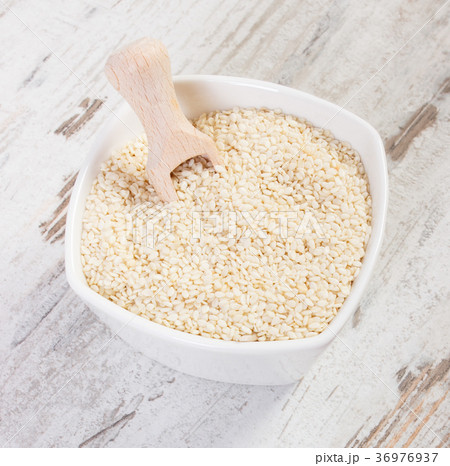 Heap of sesame containing calcium and fiber Heap of sesame containing calcium and fiber 36976937