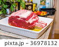 Raw beef Rib steak with bone in roasting tray on 36978132