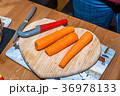 Fresh clean carrots with knife on heart shaped 36978133