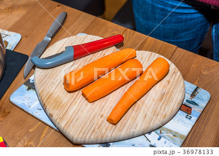 Fresh clean carrots with knife on heart shaped Fresh clean carrots with knife on heart shaped 36978133