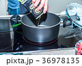 Closeup view pouring vegetable olive oil into 36978135