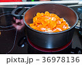 Fresh carrots and onions frying in pan casserole 36978136