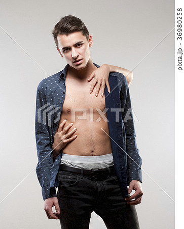 Teenage Boy in Shirt with Female Hands Touching Him. 36980258