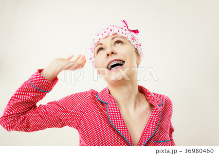 Funny woman wearing pajamas and bathing cap Funny woman wearing pajamas and bathing cap 36980460