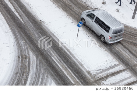 Car on road covered with snow Car on road covered with snow 36980466