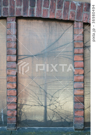 Broken window in old factory building Broken window in old factory building 36980494