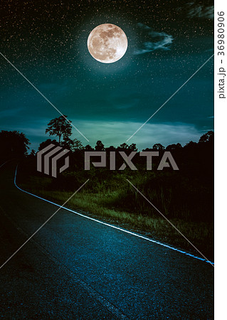 Dark sky with full moon and roadway. Dark tone. 36980906