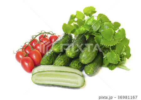 vegetables cucumbers and tomatoes on a white  36981167