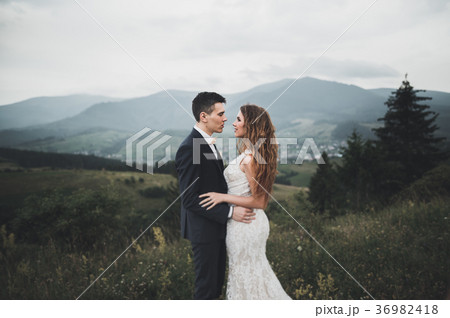 Young newly wed couple, bride and groom kissing Young newly wed couple, bride and groom kissing 36982418