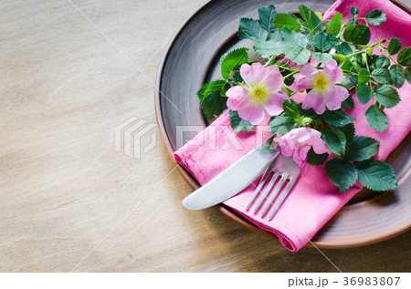 Festive Table setting with pink flowers. Festive Table setting with pink flowers. 36983807