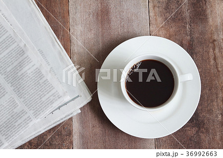 Topview ginger bread with news paper on table Topview ginger bread with news paper on table 36992663