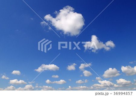 Light cumulus clouds against the blue sky. Light cumulus clouds against the blue sky. 36994857