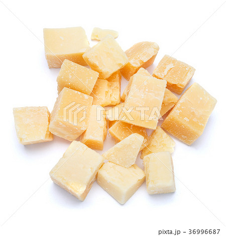 Small pieces of parmesan cheese on white 36996687