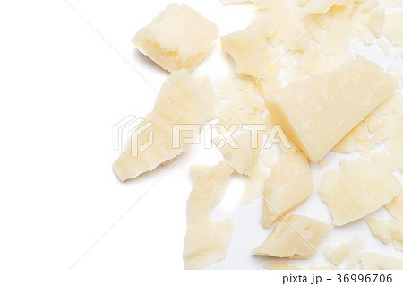 Small pieces of parmesan cheese on white 36996706