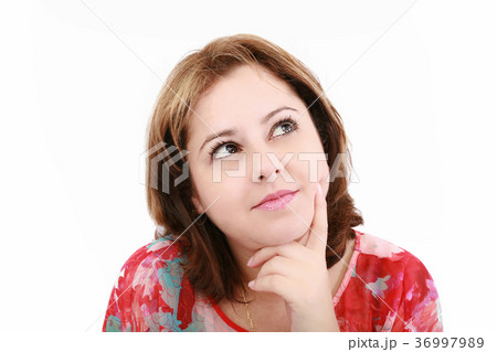 Closeup of an attractive young woman thinking 36997989