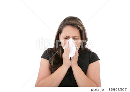 A woman with a cold or blowing her nose. 36998507