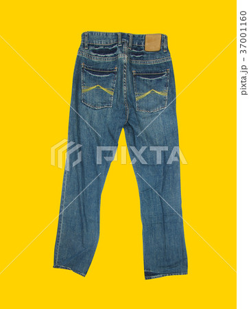 Casual jeans on yellow background 37001160