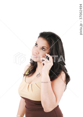 serious businesswoman on cell phone looking up serious businesswoman on cell phone looking up 37002494