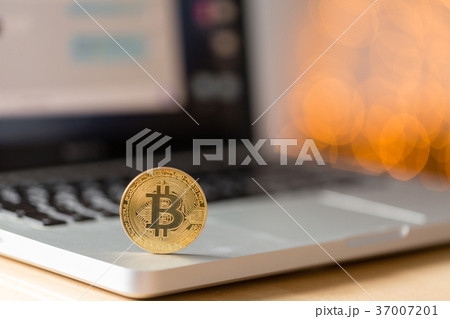 coin bitcoin on the laptop keyboard. the concept 37007201