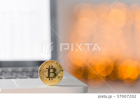 coin bitcoin on the laptop keyboard. the concept 37007202