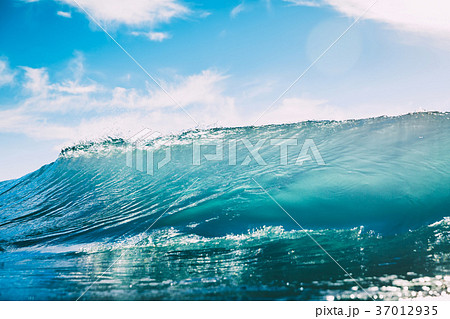 Blue wave in ocean. Clear wave and sun light 37012935