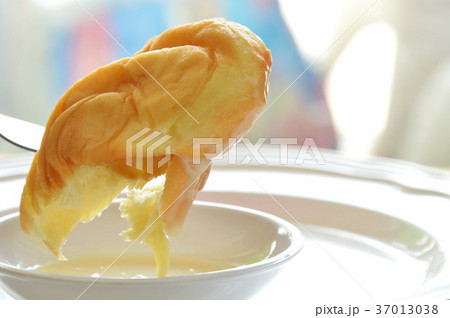 soft twist bread dipping sweetened condensed milk soft twist bread dipping sweetened condensed milk 37013038