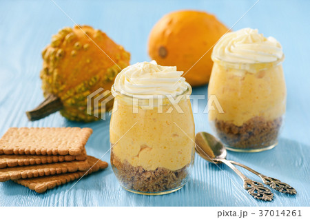 No bake pumpkin cheesecake with whipped cream. 37014261