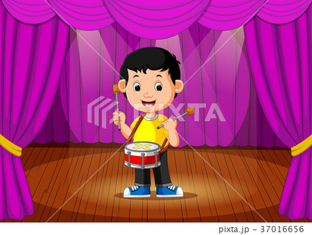 Cute boy playing drum on stage Cute boy playing drum on stage 37016656