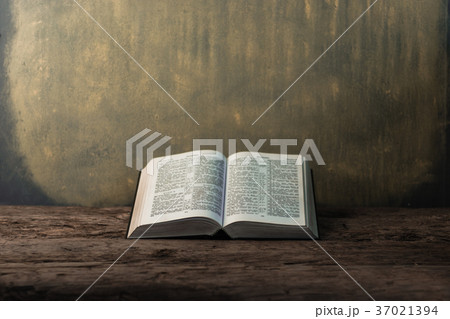 Bible and the crucifix on a old wooden oak table. 37021394