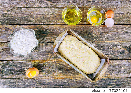 flour baking background with raw egg wheat ear 37022101