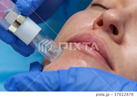 Woman receiving injection Woman receiving injection 37022676