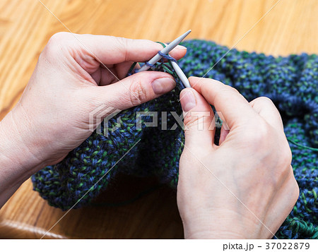 female hands knit pullover from wool close up 37022879