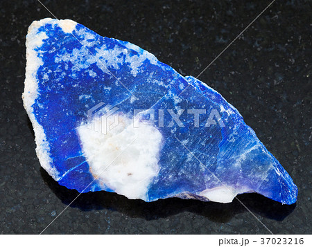 rough lazurite (lapis lazuli) stone on dark 37023216