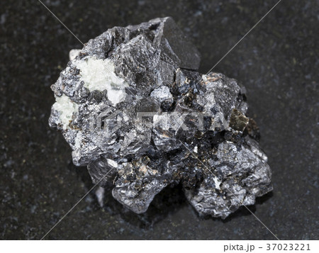 raw crystalline Magnetite stone on dark 37023221
