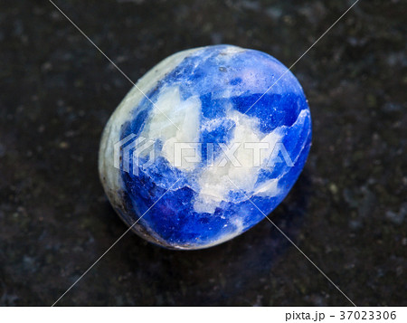 polished Sodalite gem stone on dark 37023306