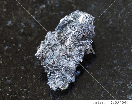 raw hematite ore on dark background raw hematite ore on dark background 37024040