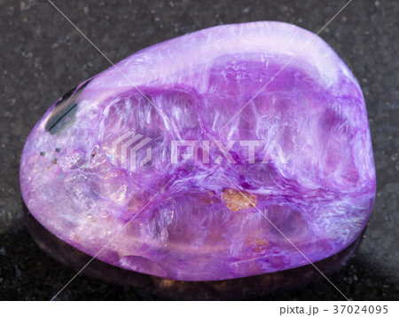 tumbled Charoite gemstone on dark tumbled Charoite gemstone on dark 37024095