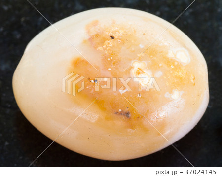 polished brown Agate gemstone on dark 37024145