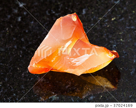 crystal of cornelian (red chalcedony) on dark 37024169