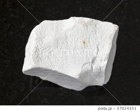 rough chalkstone on dark background rough chalkstone on dark background 37024351