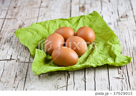 fresh brown eggs on green napkin fresh brown eggs on green napkin 37029015